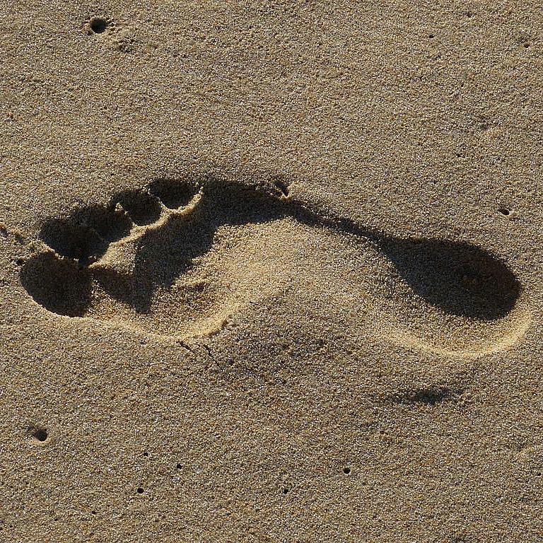 Fußabdruck im Sand